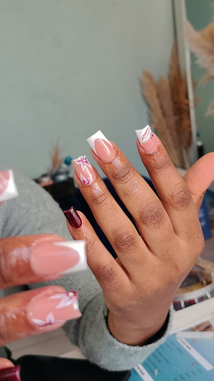 French nail set with floral art by Bubbles Beauty Bar